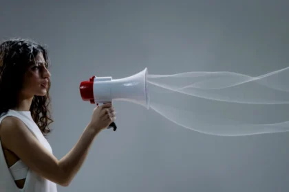 Wavy Haired Woman Holding a Megaphone
