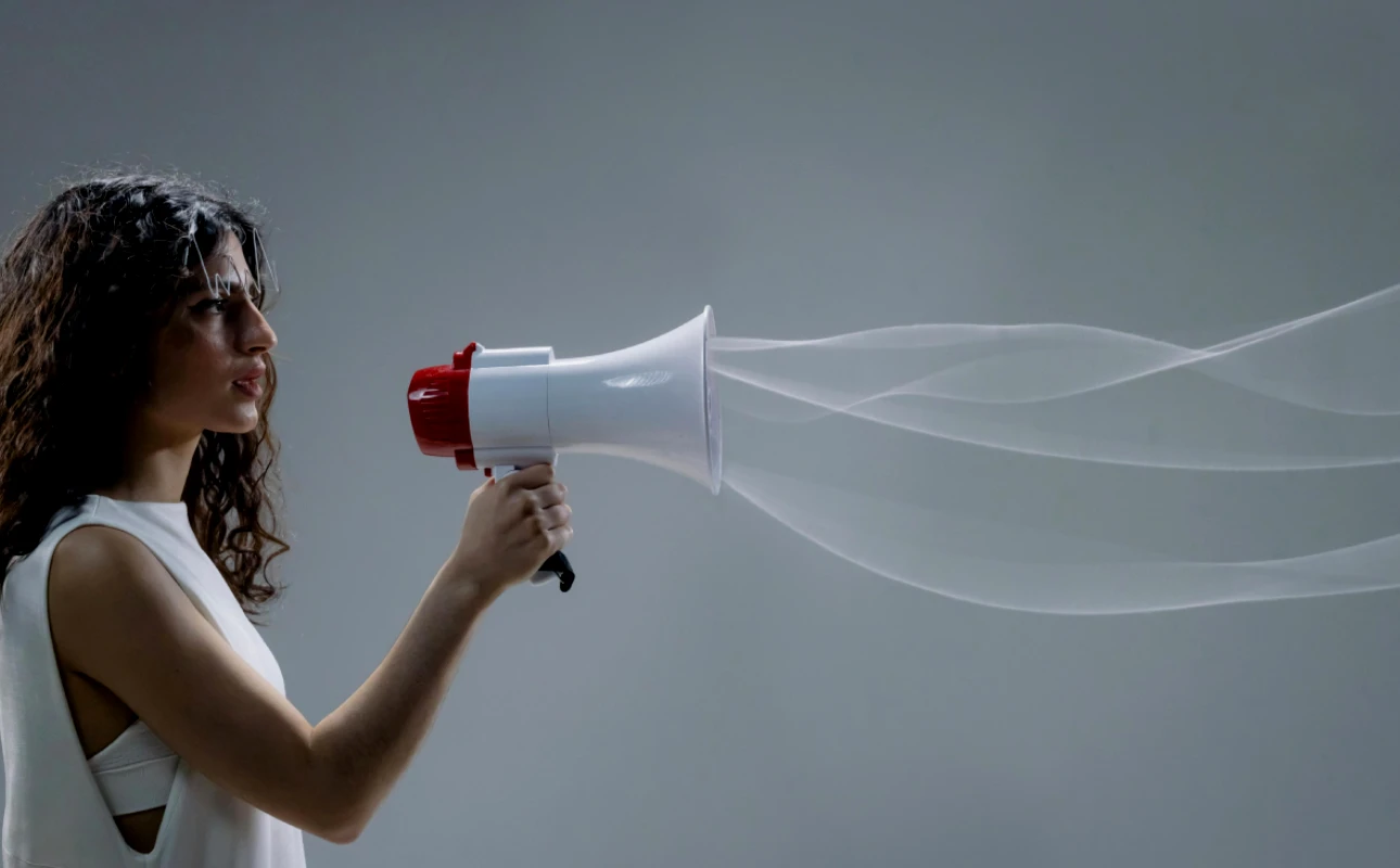 Wavy Haired Woman Holding a Megaphone