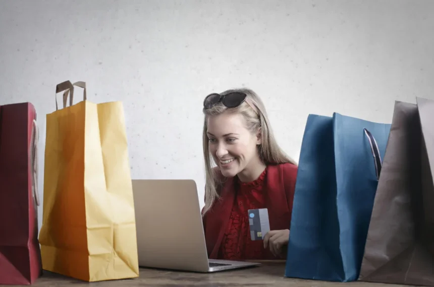 A woman shopping online using her laptop and credit card. The Future of Customer Experience in 2025 and Beyond